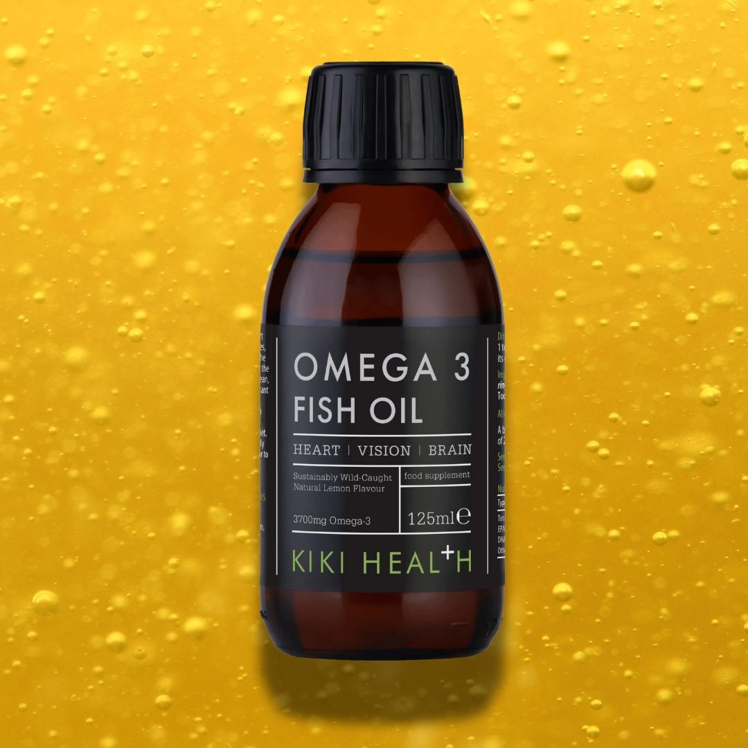 KIKI Health Omega 3 Fish Oil bottle on golden bubble background showcasing natural purity and lemon flavour
