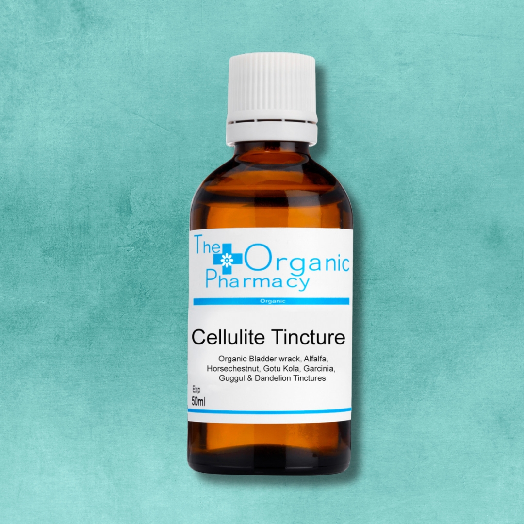 The Organic Pharmacy Cellulite Tincture natural herbal formula with circulation-boosting ingredients on turquoise background