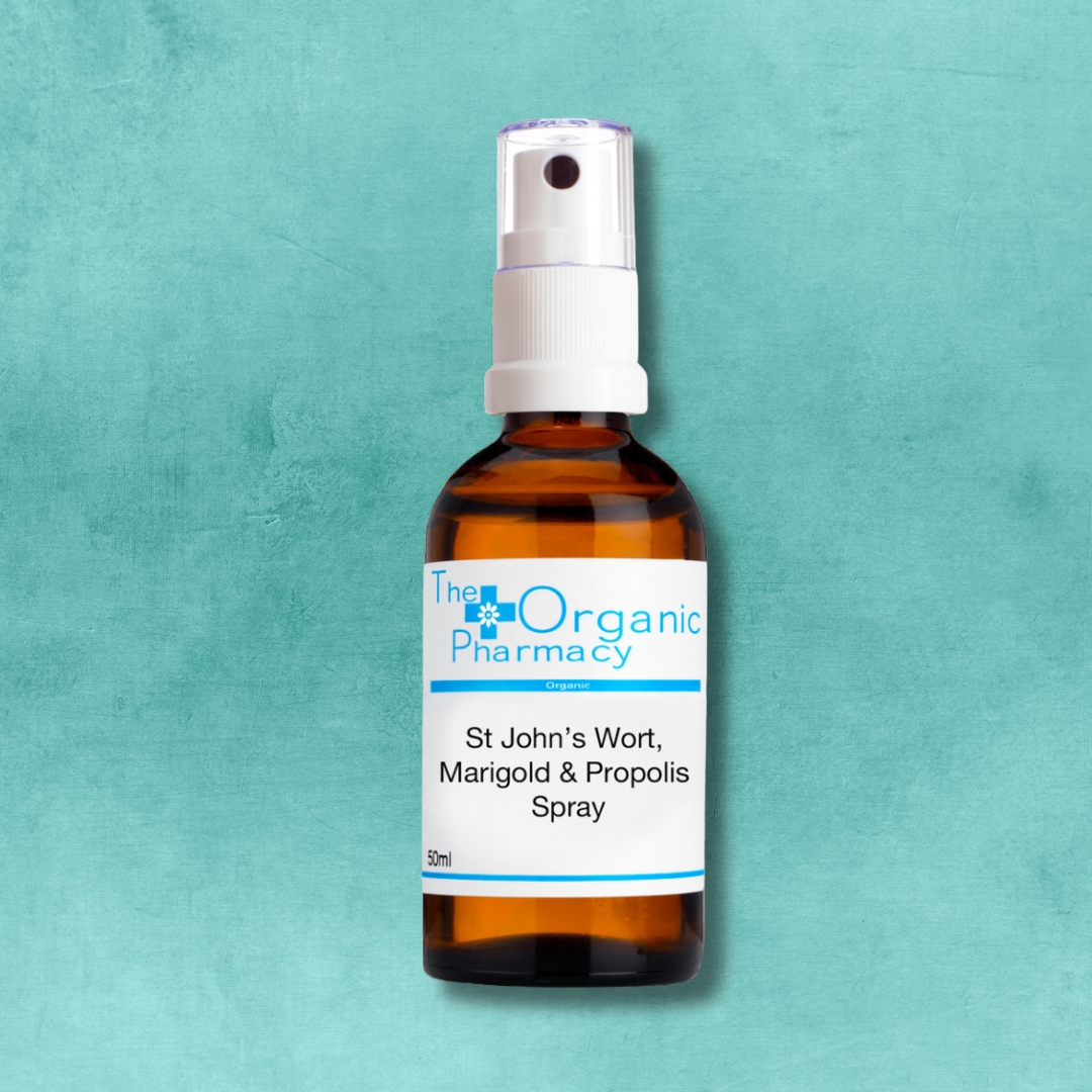 The Organic Pharmacy St John’s Wort Marigold and Propolis Spray 50ml natural remedy bottle on turquoise background