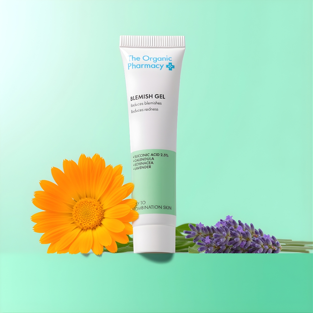 The Organic Pharmacy Blemish Gel displayed with calendula and lavender to highlight its soothing botanical ingredients.