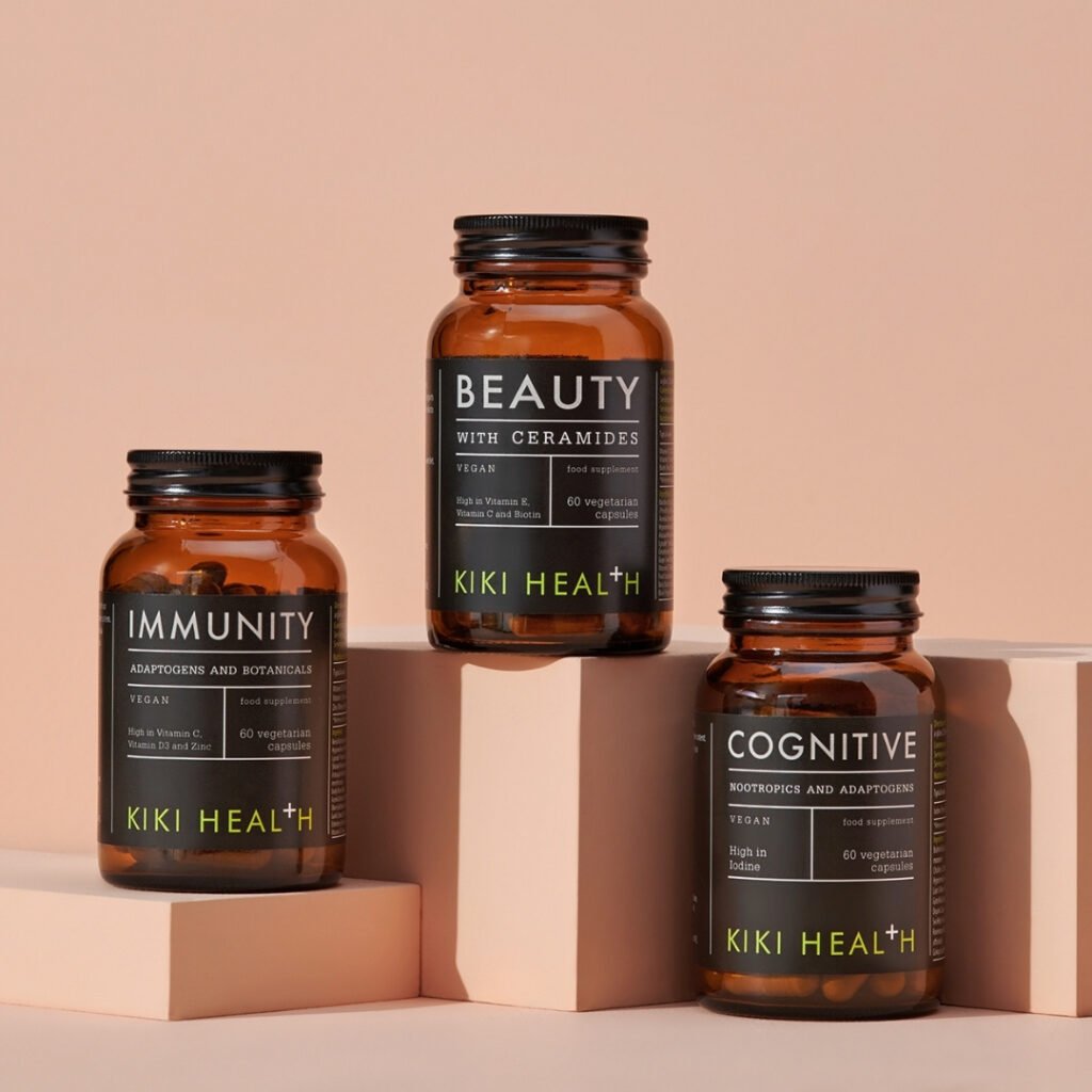 KIKI Health vegan food supplements displayed in amber glass bottles, including Beauty with Ceramides, Immunity and Cognitive formulas.